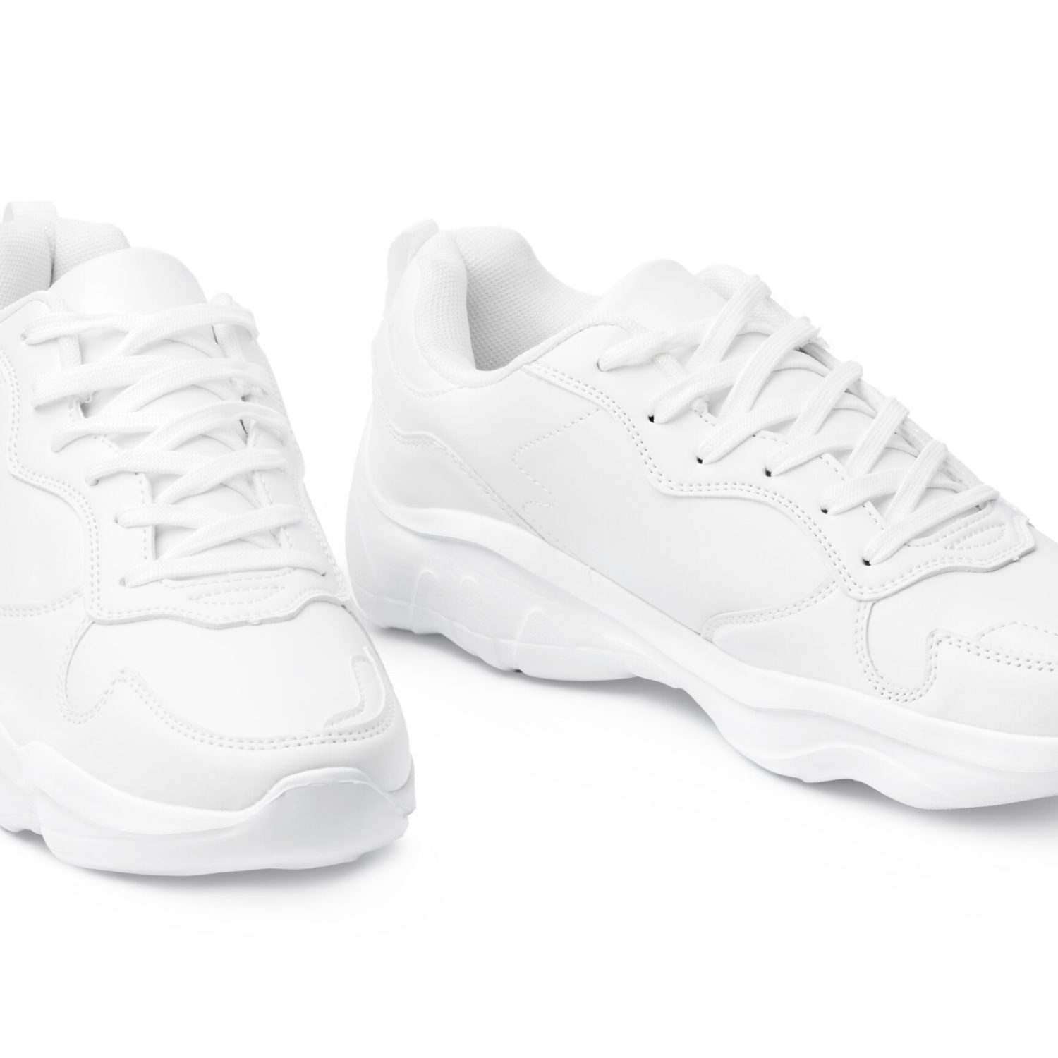 New pair of white sneakers isolated on white background