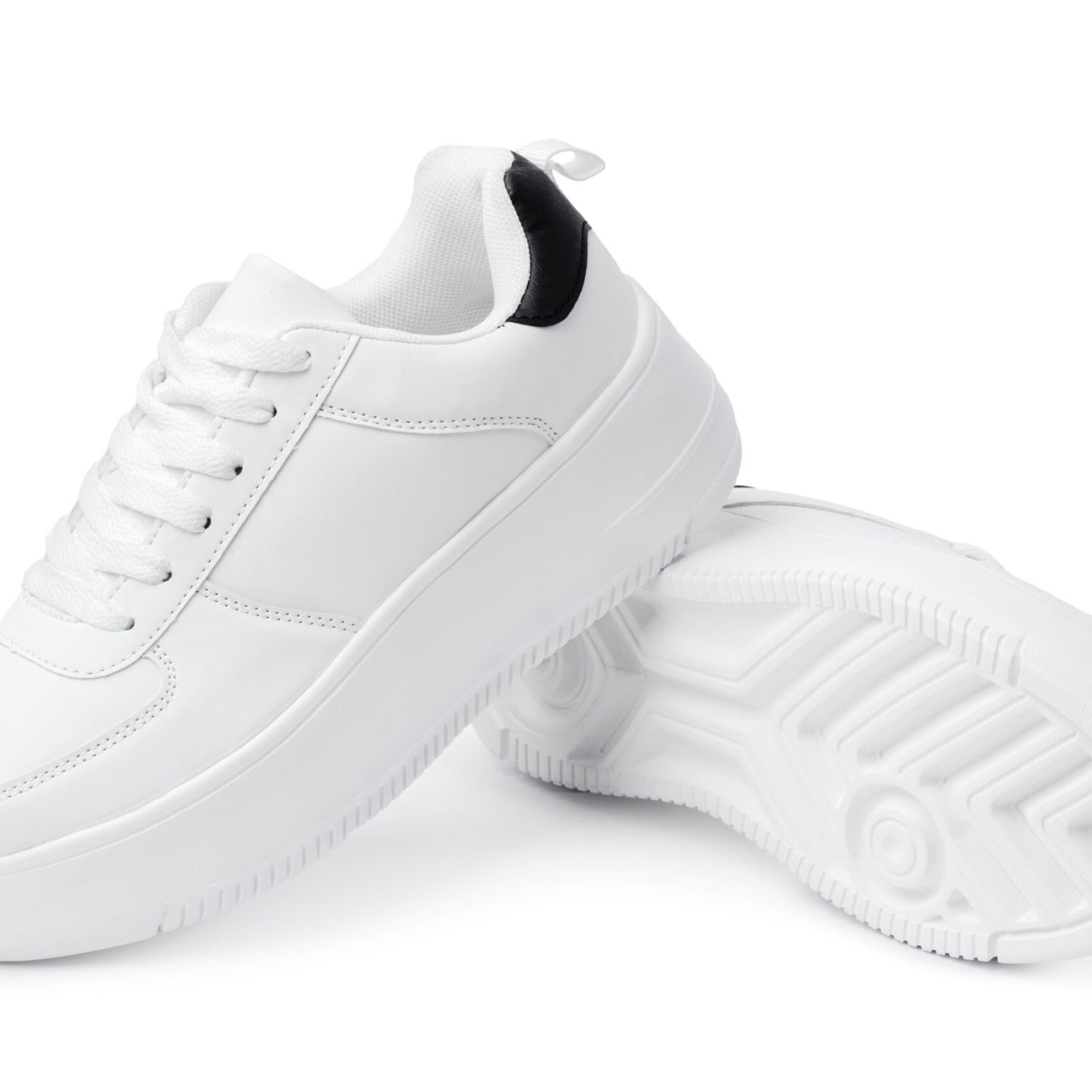 New pair of white sneakers isolated on white background